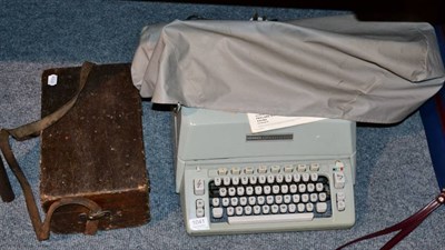 Lot 1041 - A Hermes ambassador electric typewriter with instruction booklet and original invoice; together...