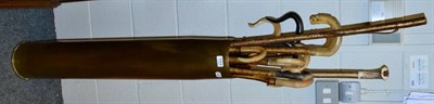 Lot 1054 - Large brass spent shell case, containing eleven horn handled crooks, an antler handled walking cane