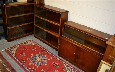 Lot 1066 - Two three-tier stacking bookshelves and a two-tier example (3)