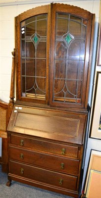 Lot 1068 - A 1920s/30s oak bureau bookcase