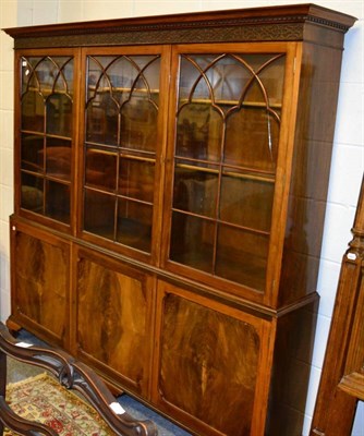 Lot 1070 - Mahogany glazed bookcase cabinet with blind fretwork decoration