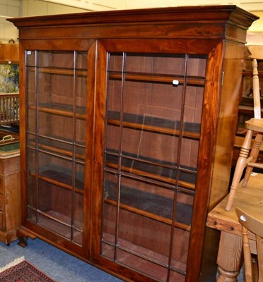 Lot 1074 - Early 20th century glazed mahogany bookcase with adjustable shelves