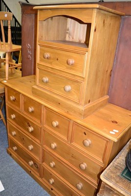 Lot 1078 - A pine chest of drawers and matching bedside cabinet