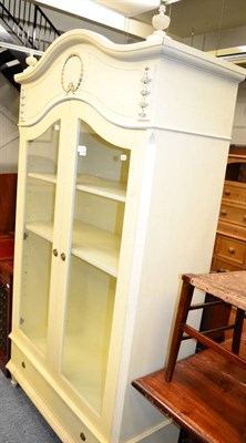 Lot 1083 - A cream painted cupboard