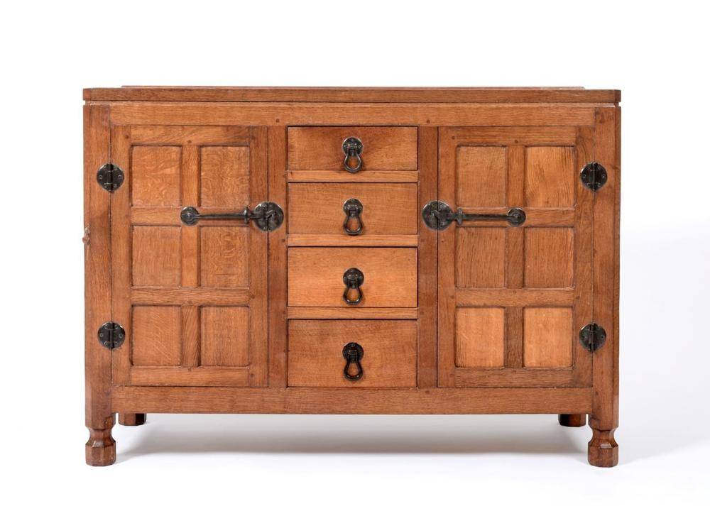 Lot 544 - A Robert  "Mouseman " Thompson Panelled Oak 4ft Sideboard, with raised upstand above four...