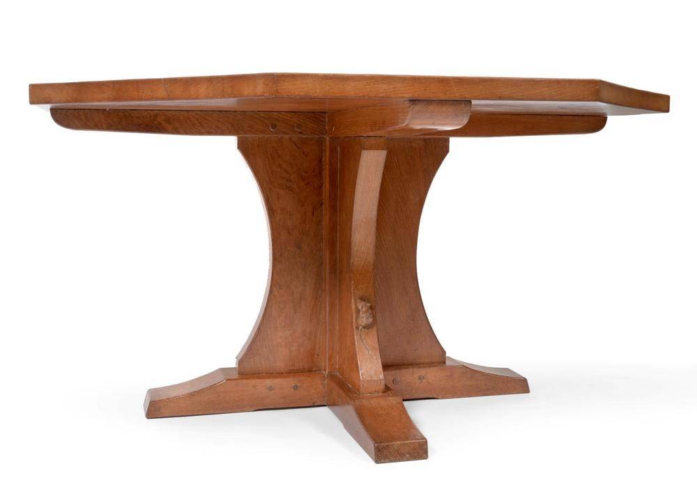 Lot 545 - A Robert  "Mouseman " Thompson Oak 4ft 6 " Octagonal Dining Table, on a cruciform base, with carved