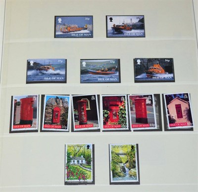 Lot 46 - Three Boxes housing an assortment of world. Includes Channel Islands and Isle of Man. Large...