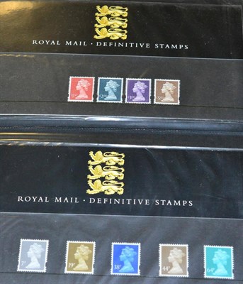 Lot 593 - Great Britain. A Three volume collection of Presentation packs from 1900 to 2003, including...