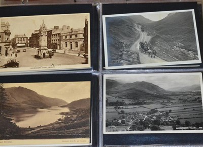 Lot 631 - Lake District. A collection of Abraham coloured cards in an album; Conistan cards in small...