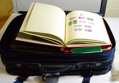 Lot 92 - Blue Suitcase comprising ten albums and stockbook of world issues. Includes a GB collection,...