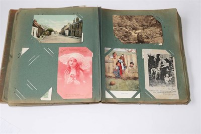 Lot 267 - A Distressed Album housing a mix of topographical, social history, real photographic, comic...