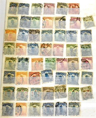 Lot 391 - China. Various mint and used in a red stock book. Includes British Post Offices in China.