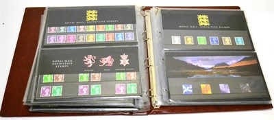 Lot 9 - Great Britain. A four volume collection of Presentation packs early 1980's to 2000. Includes...