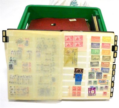 Lot 104 - Worldwide in a green plastic container. Includes a small bundle of Postal history