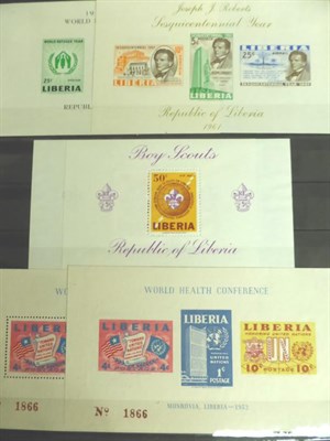 Lot 386 - Liberia. A range of mint and used including Officials and M/S's in a red stockbook