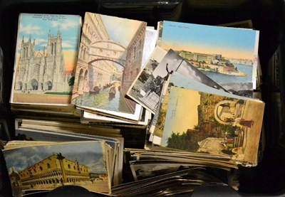 Lot 532 - Hundreds of Foreign Postcards, mainly unused, in a black plastic container