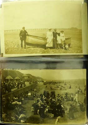 Lot 588 - Saltburn by the Sea. One hundred and sixteen postcards in a maroon album. Includes aerial...