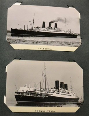 Lot 607 - Maritime. A blue album housing approximately two hundred and fifty photographs and postcards of...