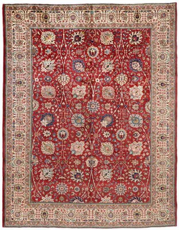 Lot 823 - Tabriz Carpet Iranian Azerbaijan The brick red field of Shah Abbas design enclosed by ivory borders