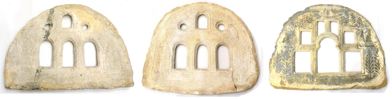 Lot 896 - A Middle Eastern Carved Stone Architectural Window, of arched form with six various lights...