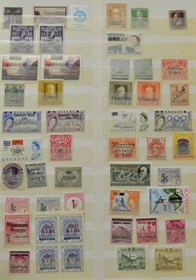 Lot 107 - Overprints and Surcharges from around the world in a part filled red stockbook