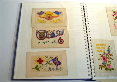 Lot 497 - First World War Postcards and other cards in one album. Includes seventeen Silks. Also...