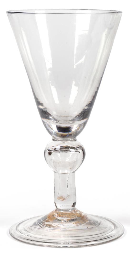 Lot 1 - A Heavy Baluster Wine Glass, circa 1740, the rounded funnel bowl on a baluster stem with air...