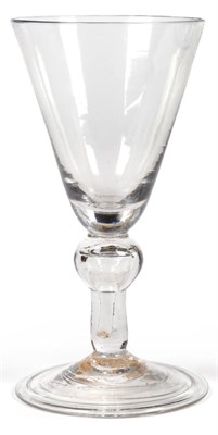 Lot 1 - A Heavy Baluster Wine Glass, circa 1740, the rounded funnel bowl on a baluster stem with air...