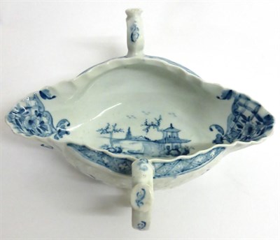 Lot 22 - A Worcester Porcelain Two-Handled Sauce Boat, circa 1755-60, painted in underglaze blue with...