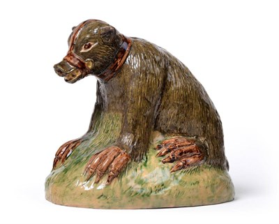 Lot 27 - A Pratt-type Pottery Figure of a Bear, circa 1800, the naturalistically modelled seated animal with