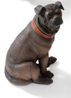 Lot 68 - An Austrian Painted Terracotta Figure of a Pug, circa 1900, seated, with glass eyes and orange...
