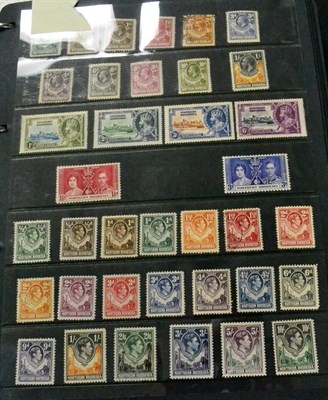 Lot 93 - British Africa and Ceylon in a black binder, with some miscellaneous at back. A selection of...