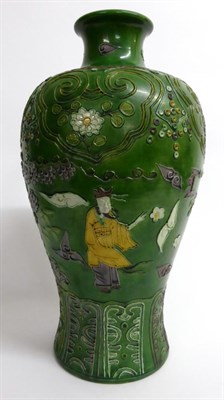 Lot 89 - A Chinese Sancai Glazed Porcelain Meiping, Qing Dynasty, decorated with figures in a garden...