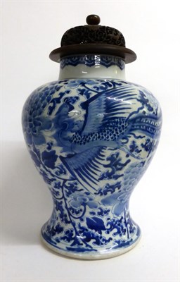 Lot 93 - A Chinese Porcelain Baluster Jar, 19th century, painted in underglaze blue with phoenix amongst...
