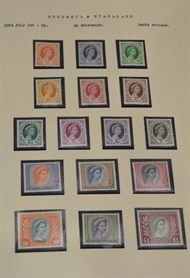 Lot 255 - Rhodesia and Nyasaland. A red springback album housing an 1954 to 1963 collection including...