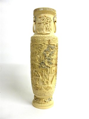 Lot 109 - A Chinese Ivory Vase, circa 1940-50, of baluster form with loop and mask handles, carved with...