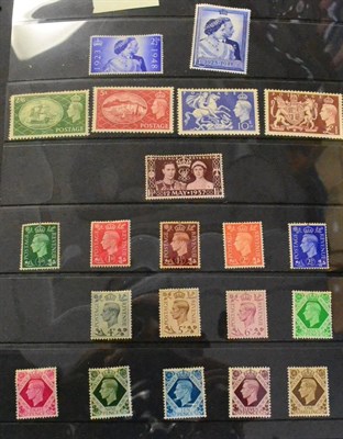 Lot 415 - Great Britain. A black binder housing a 1937 to 1970 mint collection. Noticed 1937 set to 1s,...