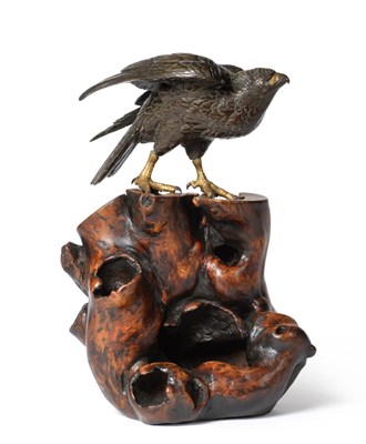 Lot 126 - A Japanese Gilt and Patinated Bronze Figure of a Hawk, Meiji period, naturalistically modelled...