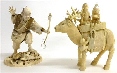 Lot 133 - A Japanese Ivory Okimono of an Archer, Meiji period, wearing traditional dress standing on a...