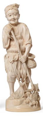Lot 136 - A Japanese Ivory Okimono of a Fisherman, Meiji period, standing wearing a grass apron holding a...