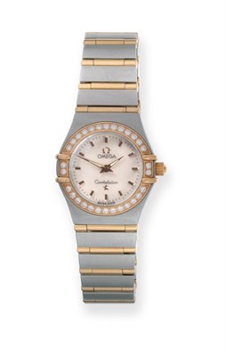 Lot 157 - A Lady's Bi-Metal Diamond Set Wristwatch, signed Omega, model: Constellation, circa 2006,...