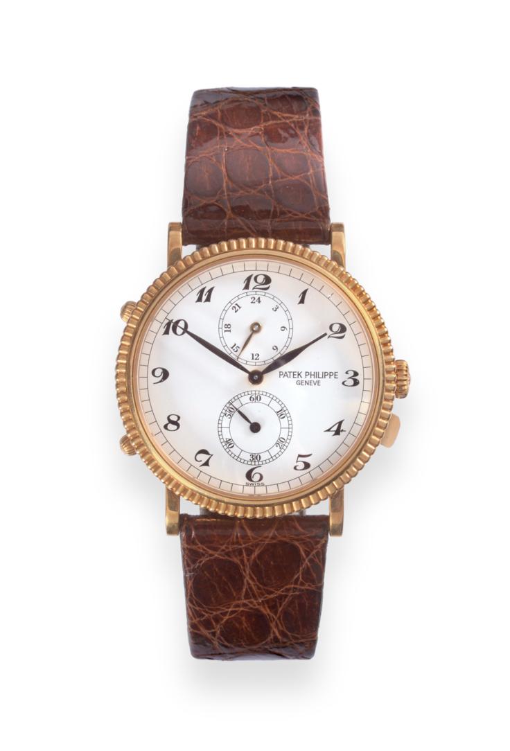 Lot 184 - An 18ct Gold Dual Time Zone Wristwatch, signed Patek Philippe, Geneve, model: travel time, ref:...