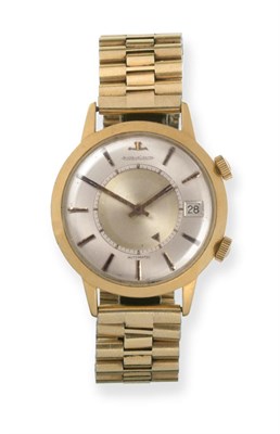 Lot 194 - An 18ct Gold Automatic Calendar Alarm Wristwatch, signed Jaeger leCoultre, model: Memovox,...