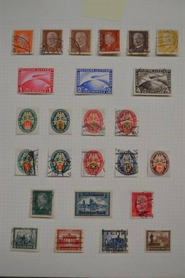Lot 58 - World A-Z in thirteen albums and two small tins. Some better noted including Germany 1928 -...