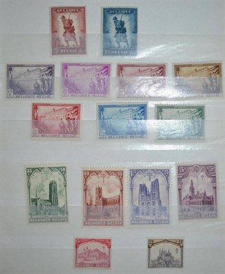 Lot 148 - Belgium. A small red stockbook sparsely filled. Includes 1919 5f and 10f mint; 1928 Anti -...