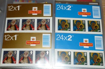 Lot 468 - Great Britain. A collection of nearly one hundred QEII decimal booklets. Includes Christmas,...