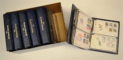 Lot 34 - The Sumner Collection of 22ct gold replicas of British stamps in five volumes. A further album...