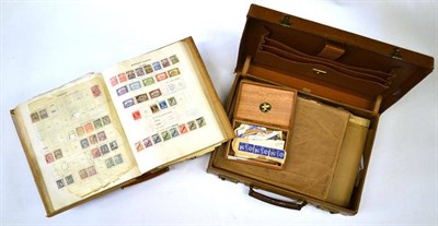 Lot 43 - Two Small Attaché Cases housing world in albums and loose. Includes two Ideal albums sparsely...