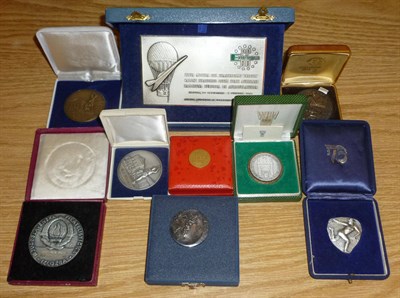 Lot 114 - Eight White Metal and other metal cased International medals. Includes Brussels 1957, WIPA...