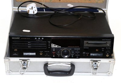 Lot 2084 - Sharp MD/CD Deck MD-R30 triple CD player in hard case, together with a Yamaha PSR 630...